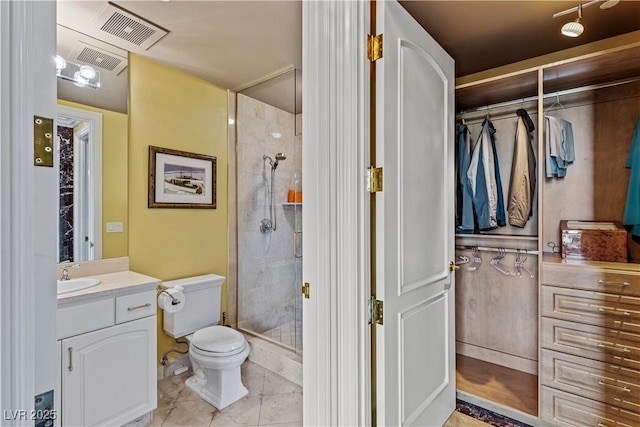1 Hughes Center Dr Unit 308, Las Vegas, NV 89169 - bathroom featuring toilet, vanity, a shower stall, and tile patterned floors