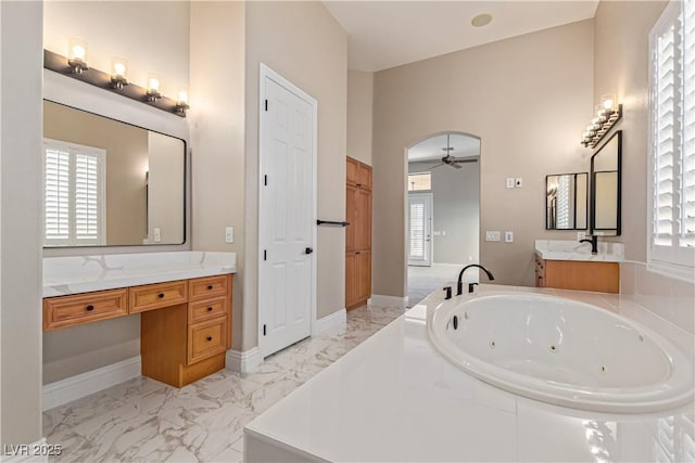 5576 Buena Martina Way, Las Vegas, NV 89141 - full bath with a ceiling fan, a tub with jets, vanity, and marble finish floors