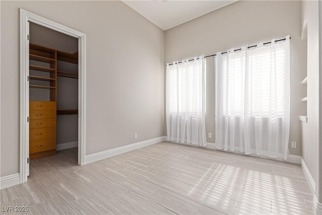 5576 Buena Martina Way, Las Vegas, NV 89141 - unfurnished bedroom with a walk in closet, a closet, and baseboards
