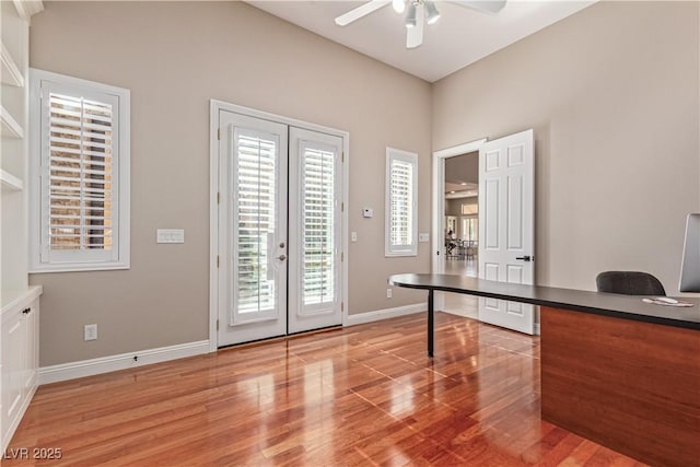 5576 Buena Martina Way, Las Vegas, NV 89141 - unfurnished office featuring french doors, light wood finished floors, a ceiling fan, and baseboards