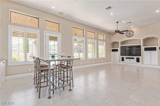 5576 Buena Martina Way, Las Vegas, NV 89141 - dining area with built in shelves, baseboards, ceiling fan, light tile patterned floors, and recessed lighting