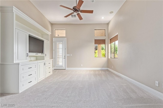 5576 Buena Martina Way, Las Vegas, NV 89141 - unfurnished living room with ceiling fan, light colored carpet, and baseboards