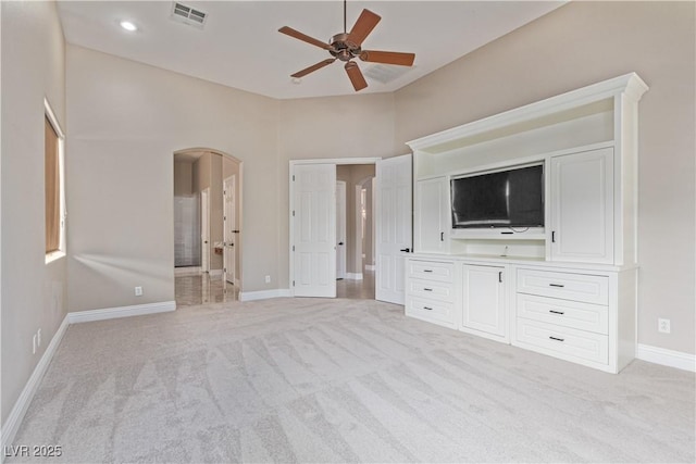 5576 Buena Martina Way, Las Vegas, NV 89141 - unfurnished bedroom featuring arched walkways, light colored carpet, baseboards, and a ceiling fan