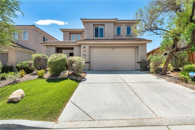 2449 Daks Loden Ct, Henderson, NV 89044 - prairie-style house featuring driveway, stucco siding, a garage, and a front lawn