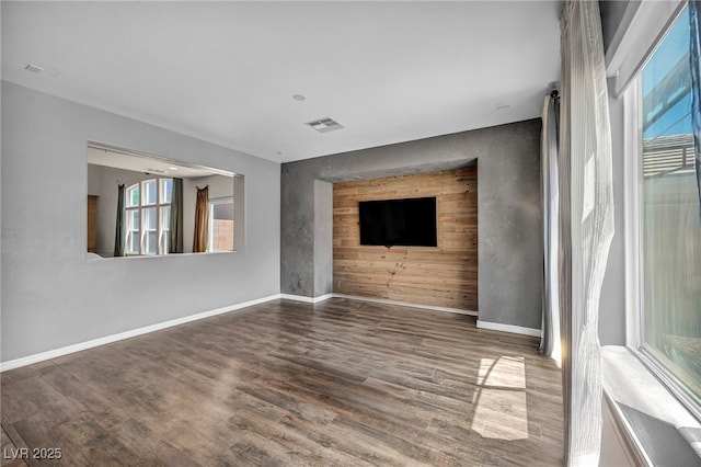 2449 Daks Loden Ct, Henderson, NV 89044 - unfurnished living room with plenty of natural light, wood finished floors, and baseboards