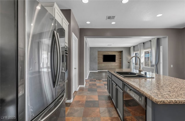 2449 Daks Loden Ct, Henderson, NV 89044 - kitchen featuring stainless steel fridge, black dishwasher, a sink, baseboards, and open floor plan