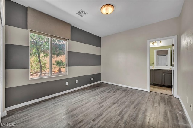 2449 Daks Loden Ct, Henderson, NV 89044 - spare room with wood finished floors and baseboards
