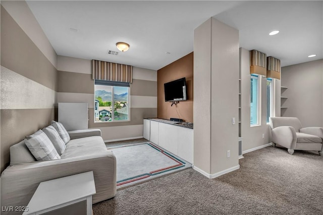 2449 Daks Loden Ct, Henderson, NV 89044 - carpeted living room featuring plenty of natural light, baseboards, and recessed lighting