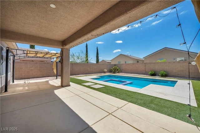 2449 Daks Loden Ct, Henderson, NV 89044 - view of swimming pool with a patio area, a fenced backyard, and a pool with connected hot tub