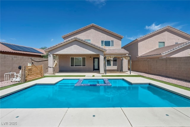 2449 Daks Loden Ct, Henderson, NV 89044 - back of house with a patio, a pool with connected hot tub, stucco siding, and a fenced backyard