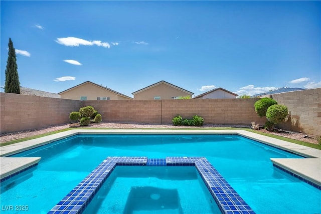 2449 Daks Loden Ct, Henderson, NV 89044 - view of swimming pool with a pool with connected hot tub and a fenced backyard