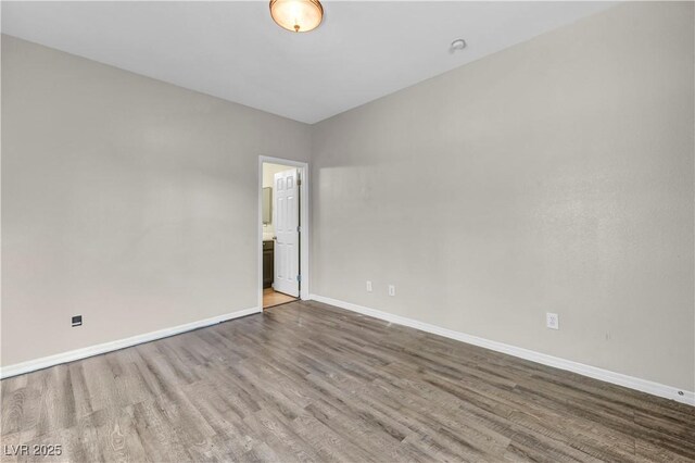 2449 Daks Loden Ct, Henderson, NV 89044 - spare room featuring wood finished floors and baseboards