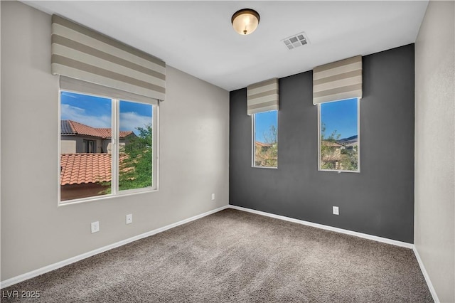 2449 Daks Loden Ct, Henderson, NV 89044 - carpeted empty room featuring plenty of natural light and baseboards