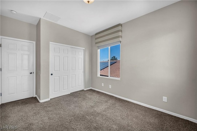 2449 Daks Loden Ct, Henderson, NV 89044 - unfurnished bedroom featuring dark colored carpet, baseboards, and a closet