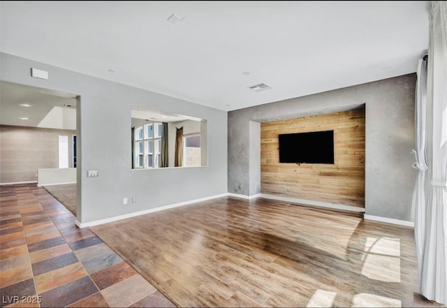 2449 Daks Loden Ct, Henderson, NV 89044 - unfurnished living room with baseboards and an accent wall