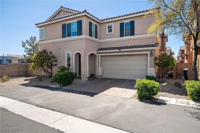 6121 Mission Gorge Ct, Las Vegas, NV 89130 - view of front facade featuring a tiled roof, a garage, stucco siding, and driveway