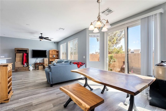 6121 Mission Gorge Ct, Las Vegas, NV 89130 - dining room featuring healthy amount of natural light, a chandelier, and light wood-style floors