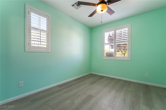11238 Meadow Cove St, Las Vegas, NV 89179 - empty room with wood finished floors, baseboards, and a ceiling fan