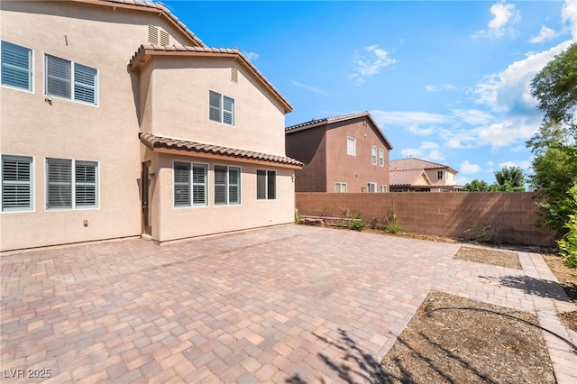 11238 Meadow Cove St, Las Vegas, NV 89179 - rear view of property with stucco siding, a tile roof, and a patio area