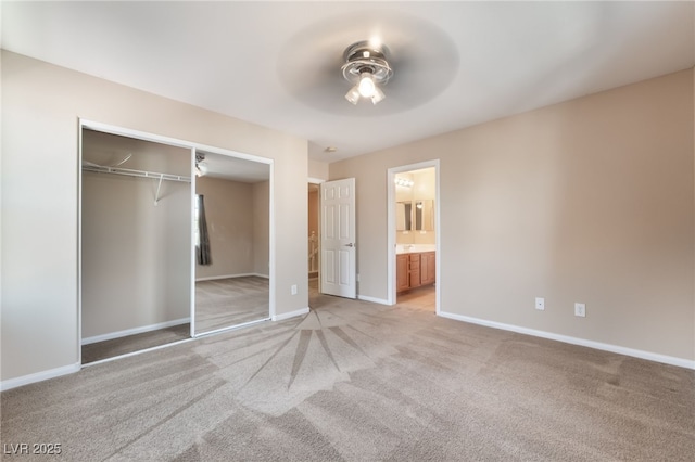 11238 Meadow Cove St, Las Vegas, NV 89179 - unfurnished bedroom featuring light colored carpet, baseboards, a closet, and ensuite bathroom