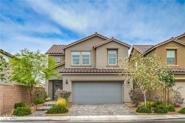 10031 Fletcher Peak Ave, Las Vegas, NV 89178 - multi unit property with a garage, stucco siding, decorative driveway, and a tiled roof