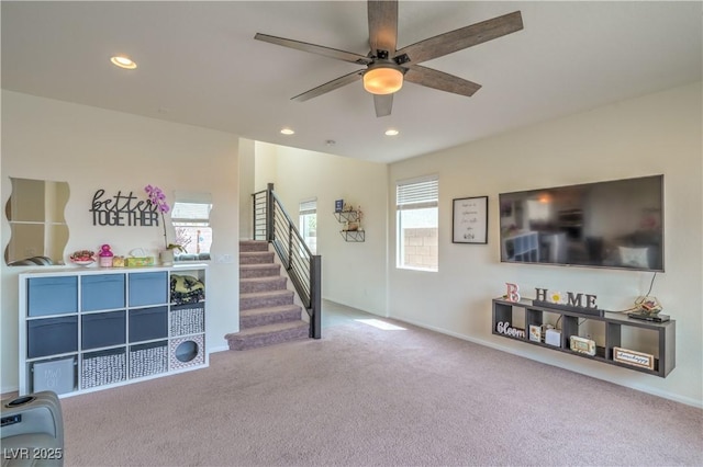 10031 Fletcher Peak Ave, Las Vegas, NV 89178 - carpeted living area featuring a ceiling fan, stairway, recessed lighting, and baseboards