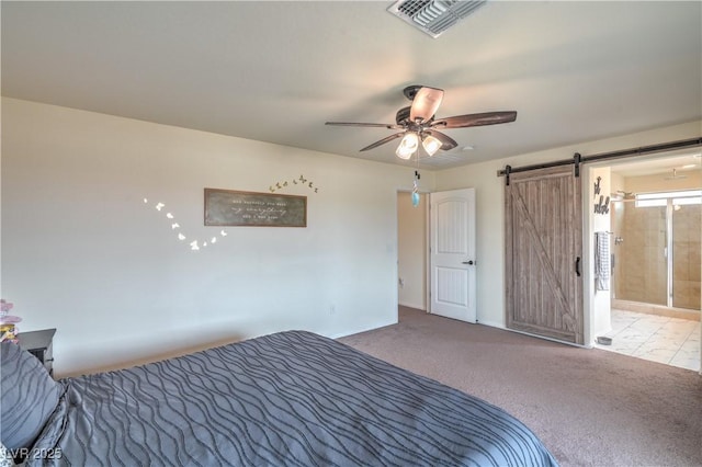 10031 Fletcher Peak Ave, Las Vegas, NV 89178 - unfurnished bedroom featuring a barn door, baseboards, carpet floors, a ceiling fan, and connected bathroom