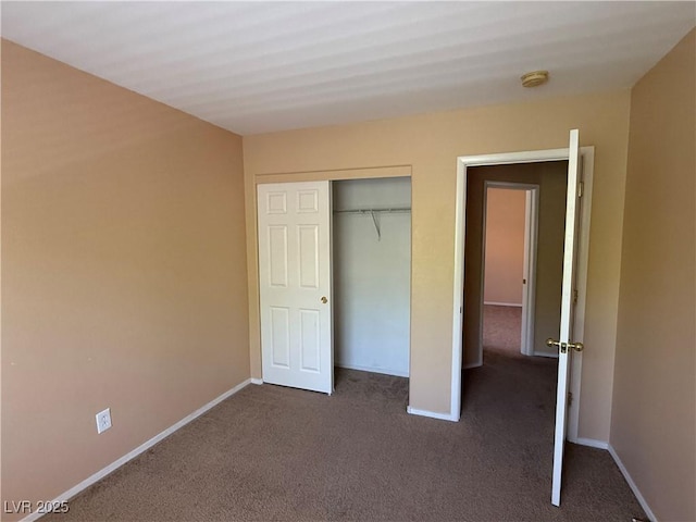 8708 Gateway Glen Dr, Las Vegas, NV 89178 - unfurnished bedroom with dark carpet, baseboards, and a closet