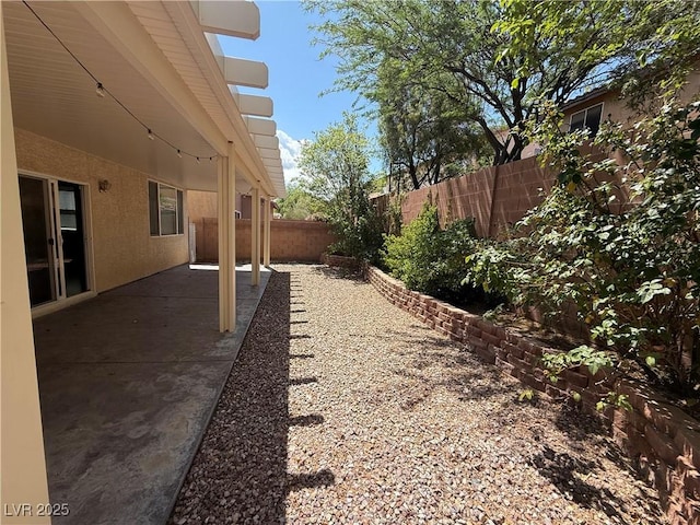 8708 Gateway Glen Dr, Las Vegas, NV 89178 - fenced backyard with a patio