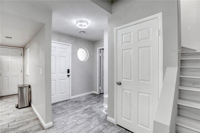 6250 W Flamingo Rd Unit 43, Las Vegas, NV 89103 - foyer with light wood-style floors, baseboards, and stairway