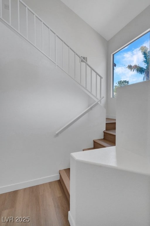 125 Firecreek Cir, Las Vegas, NV 89107 - stairs with wood finished floors and baseboards