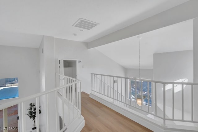 125 Firecreek Cir, Las Vegas, NV 89107 - corridor featuring an upstairs landing, wood finished floors, lofted ceiling, and a chandelier