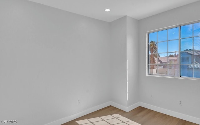 125 Firecreek Cir, Las Vegas, NV 89107 - unfurnished room with baseboards, light wood finished floors, and recessed lighting
