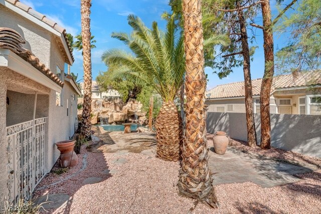 125 Firecreek Cir, Las Vegas, NV 89107 - view of yard featuring a patio area