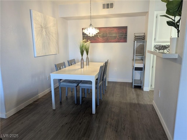 6650 W Warm Springs Rd Unit 2159, Las Vegas, NV 89118 - dining room with a chandelier, dark wood-style floors, and baseboards