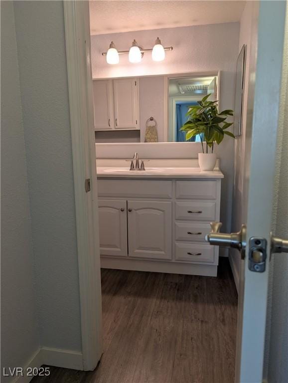 6650 W Warm Springs Rd Unit 2159, Las Vegas, NV 89118 - bathroom featuring wood finished floors and vanity