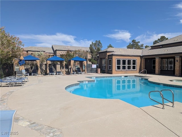6650 W Warm Springs Rd Unit 2159, Las Vegas, NV 89118 - community pool with a patio and a hot tub