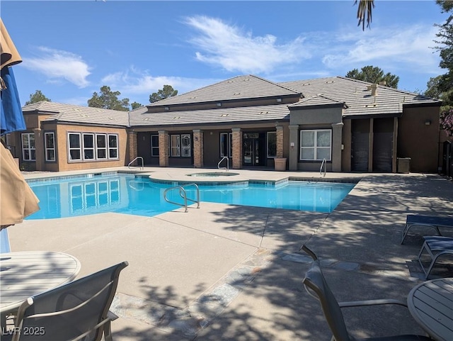 6650 W Warm Springs Rd Unit 2159, Las Vegas, NV 89118 - outdoor pool with an in-ground hot tub, a patio area, and a sink