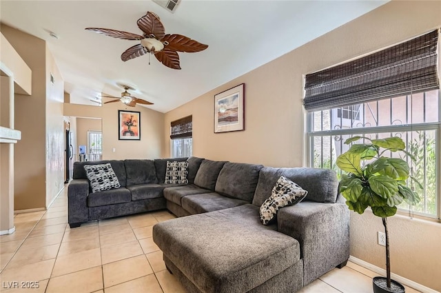 8242 Tribute Ln, Las Vegas, NV 89147 - living room featuring ceiling fan, light tile patterned floors, baseboards, and lofted ceiling