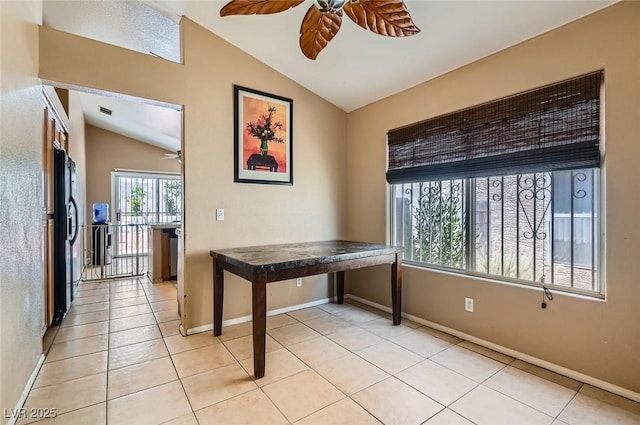 8242 Tribute Ln, Las Vegas, NV 89147 - unfurnished office featuring ceiling fan, lofted ceiling, baseboards, and light tile patterned floors