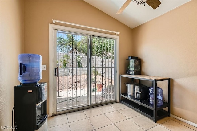 8242 Tribute Ln, Las Vegas, NV 89147 - doorway to outside featuring a ceiling fan, tile patterned flooring, and vaulted ceiling