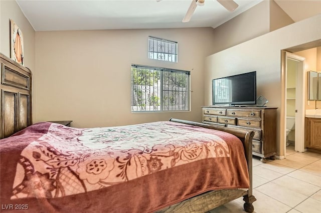 8242 Tribute Ln, Las Vegas, NV 89147 - bedroom with light tile patterned floors, high vaulted ceiling, a ceiling fan, and ensuite bath