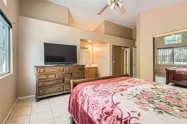 8242 Tribute Ln, Las Vegas, NV 89147 - bedroom with multiple windows, light tile patterned floors, baseboards, and a ceiling fan