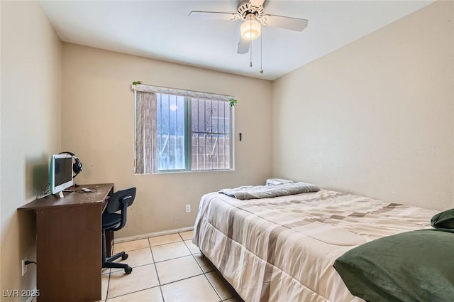 8242 Tribute Ln, Las Vegas, NV 89147 - bedroom featuring an office area, tile patterned floors, a ceiling fan, and baseboards