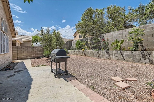 8242 Tribute Ln, Las Vegas, NV 89147 - fenced backyard featuring a patio