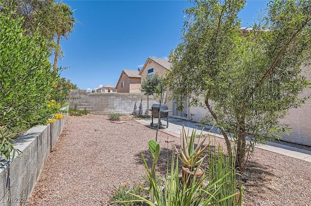 8242 Tribute Ln, Las Vegas, NV 89147 - fenced backyard with a patio