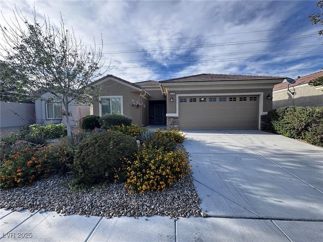 3124 Kookaburra Way N, Las Vegas, NV 89084 - single story home with stucco siding, concrete driveway, an attached garage, and stone siding