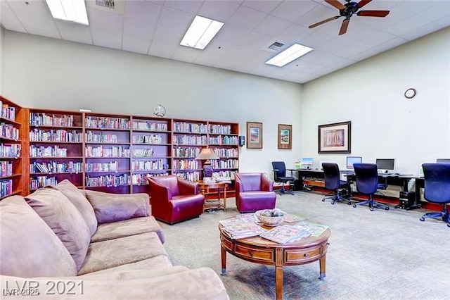 3124 Kookaburra Way N, Las Vegas, NV 89084 - carpeted living area featuring a desk, a ceiling fan, and a high ceiling