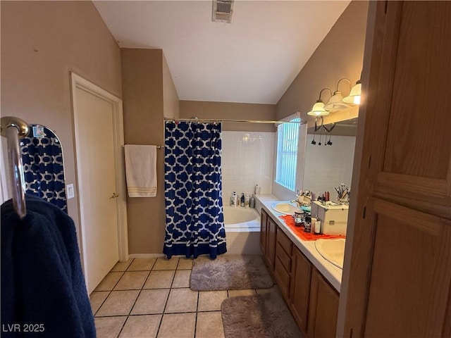 5517 Rock Creek Ln, Las Vegas, NV 89130 - bathroom with tile patterned floors, double vanity, vaulted ceiling, and shower / bath combo with shower curtain
