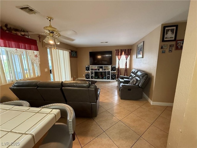 5517 Rock Creek Ln, Las Vegas, NV 89130 - living area with ceiling fan, light tile patterned floors, and baseboards